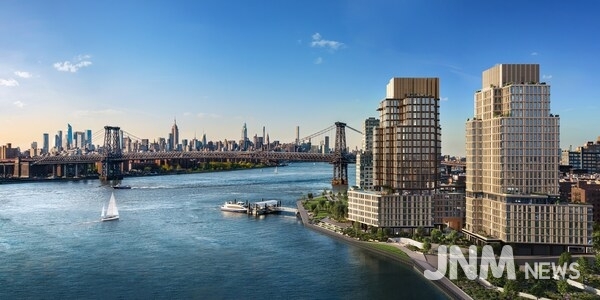 One Williamsburg Wharf rises along Brooklyn